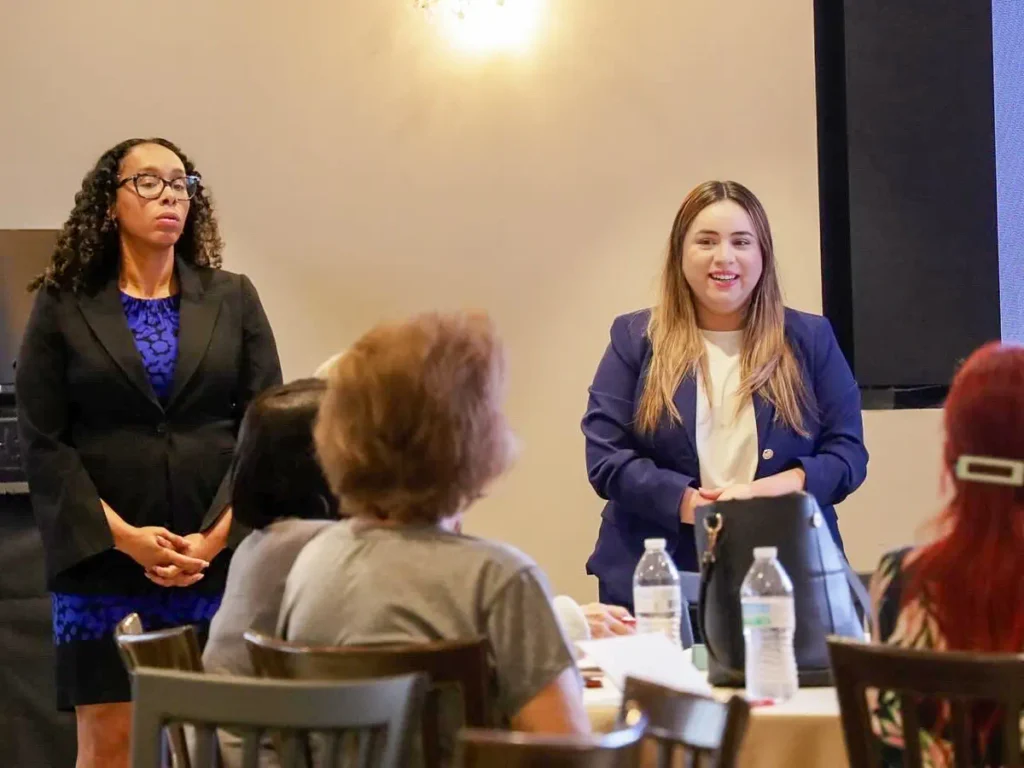 Presentation by a woman at Houston conference venue - Up Above Venue