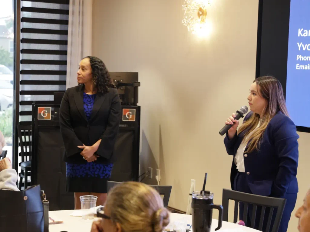 A female is hosting a conference in a Houston Conference Venue - Up Above Venue