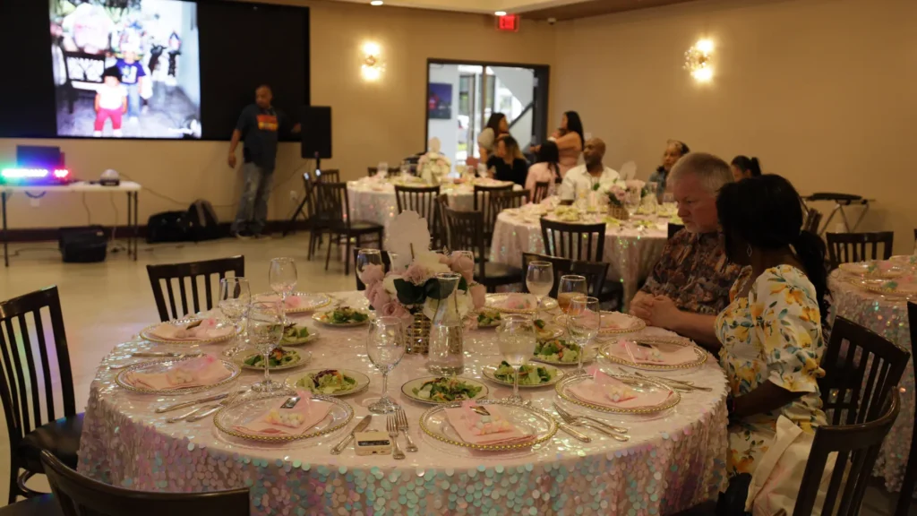 Social event venue decoration with table-chairs and projector in Houston - up above venue