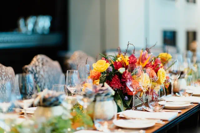 Table decoration with flowers and other equipment at Houston Social Event Venue - Up Above Venue