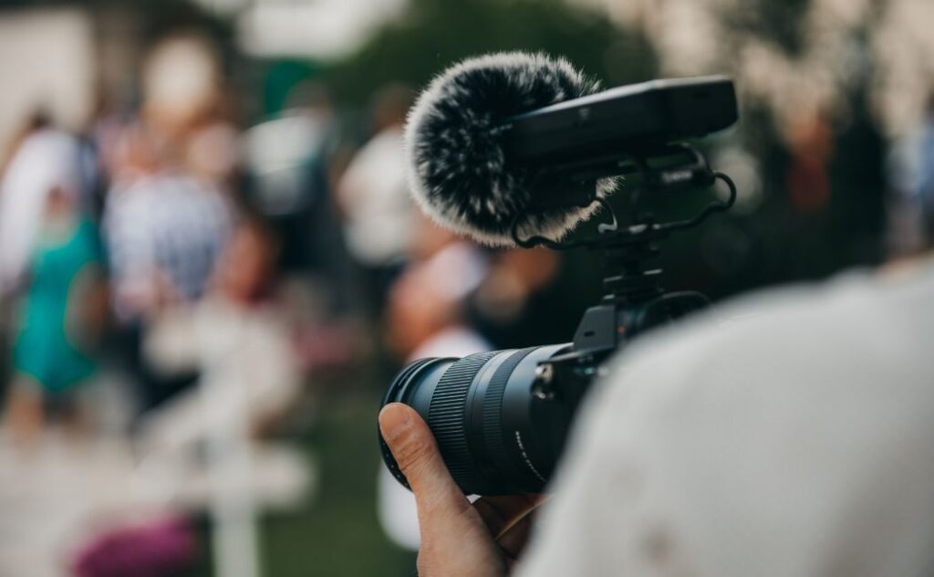 Hired photographer with his camera in a birthday party event venue